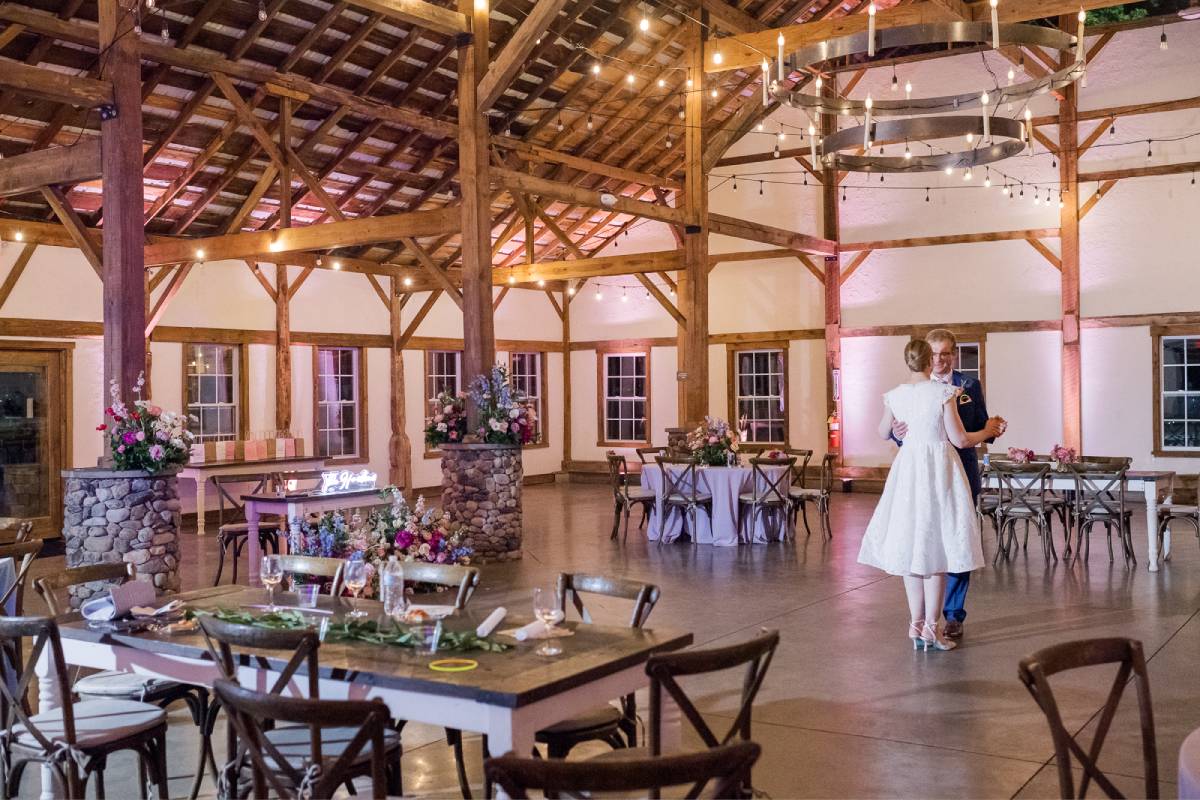 Restored Historic Stables reception hall with vaulted timber ceiling and banquet tables